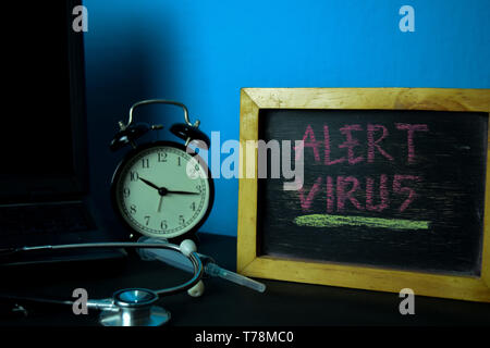 Alert Virus Planning on Background of Working Table with Office Supplies. Medical and Healthcare Concept Planning on Blue Background Stock Photo