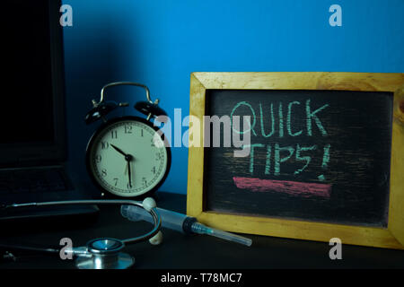 Quick Tips Planning on Background of Working Table with Office Supplies. Medical and Healthcare Concept Planning on Blue Background Stock Photo