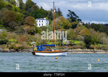 Traditional wooden gaff rigged yacht moored in Union Hall Harbour ireland Stock Photo