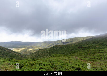 Clouds of Caldeira Branca in a national park on Flores island in the Azores. Stock Photo