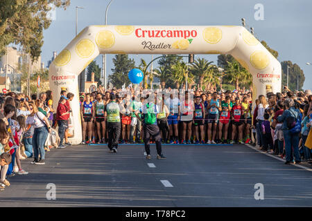 Huelva, Spain - May 5, 2019:  Runners at the start of the Huelva solidary 10K Run on May 2019. The first 10K race held in Huelva Stock Photo