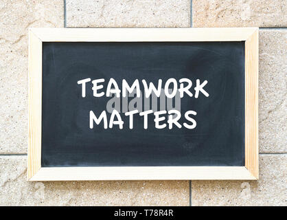 Teamwork matters, words on blackboard. Business or work place core values and concept Stock Photo