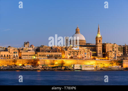 Classic postcard view to Basilica of Our Lady of Mount Carmel and St Paul's Pro-Cathedral. Valletta, Malta. Clear sky, sunset Stock Photo