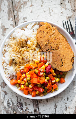 Pork roast with rice & vegetable salad Stock Photo