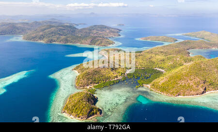 Tropical islands of the Malay Archipelago. Many islands with turquoise lagoons and coral reefs. Stock Photo