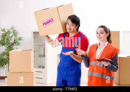 Professional movers doing home relocation Stock Photo
