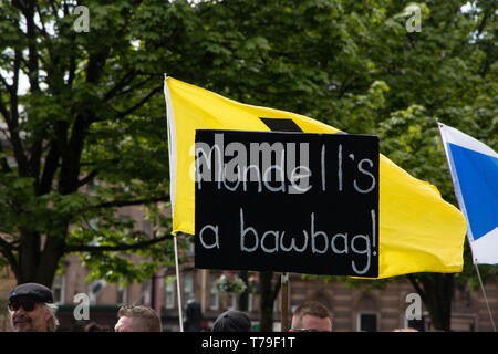 One of many homemade signs displayed at the All Under One banner march in Glasgow. This one aimed at Conservative MP David Mundell. Stock Photo