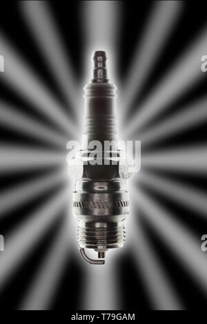 single spark plug with strong backlight glow and star effect on a black background Stock Photo