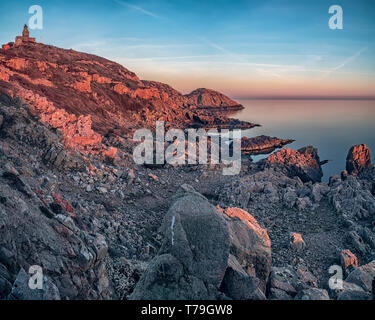 Rocky beach landscape during golden hour at Kullaberg in Sweden. Stock Photo