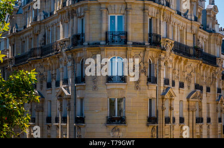 Paris residential buildings. Old Paris architecture, beautiful facade, typical french houses on sunny day. Famous travel destinations in Europe. City  Stock Photo