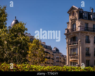 Paris residential buildings. Old Paris architecture, beautiful facade, typical french houses on sunny day. Famous travel destinations in Europe. City  Stock Photo