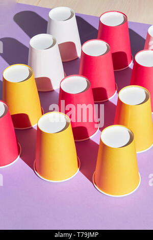 Set of colorful plastic cups isolated on white background, concept of ...