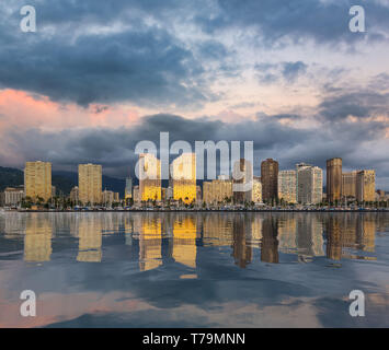 Reflections of the hotels and apartments of Waikiki on the Hawaii island of Oahu near Honolulu in artificial ocean panorama