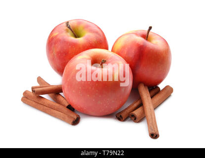 Fresh apples and cinnamon sticks on white background Stock Photo