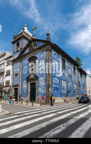 capela das Almas Church in Porto, Portugal. Blue azulejo tiled exterior facade.