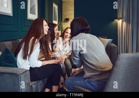 Chatting women drinking tea at home Stock Photo