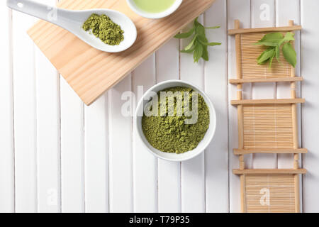 Composition with green matcha tea on wooden background Stock Photo