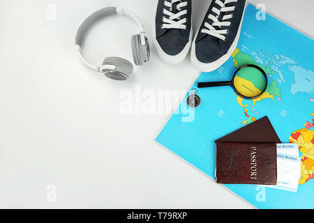 Composition with passports, immigration bureau cards and world map on white background. Travel planning concept Stock Photo