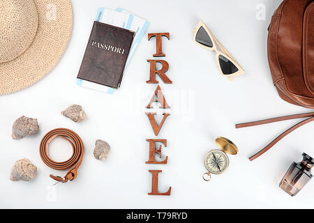 Composition with passport, immigration bureau cards, compass and word 'Travel' on white background Stock Photo