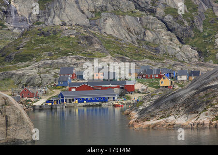The boat harbour and buildings at Aappilattoq, a small coastal settlement along the inland waters of southern Greenland. Stock Photo