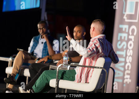 Seattle, Washington: Macklemore, given name Ben Haggerty, speaks during a panel at the Crosscut Festival. Activist and author DeRay McKesson lead a co Stock Photo