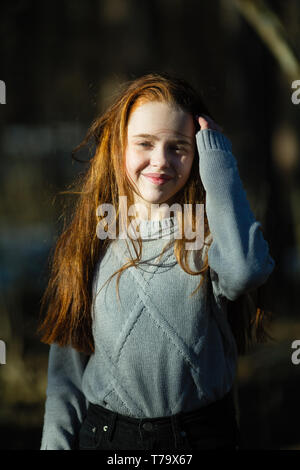 Cute twelve year old girl in the park