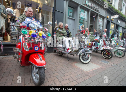 Mods and their scooters in Carnaby Street ahead of the Buckingham Palace Run where they ride around London and pass Buckingham Palace. Stock Photo