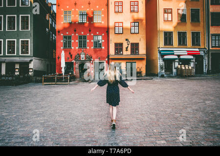 Woman tourist walking in Stockholm travel sightseeing Gamla Stan Stortorget architecture lifestyle summer trip vacations in Sweden Stock Photo