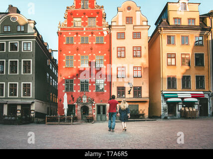 Romantic vacations couple in love traveling together in Stockholm Stortorget architecture colorful houses Sweden landmarks Stock Photo