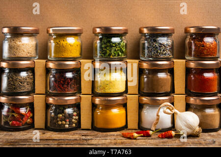 https://l450v.alamy.com/450v/t7a763/large-collection-of-spices-in-small-jars-on-the-shelf-t7a763.jpg