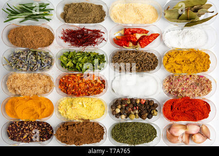 Collection of spices in small bowls flat lay Stock Photo