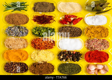Collection of spices in small bowls flat lay Stock Photo