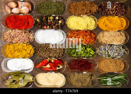 Collection of spices in small bowls flat lay Stock Photo