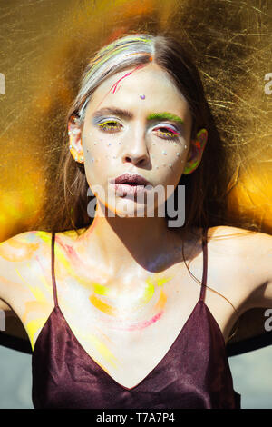 Indian woman with colorful makeup face, body art Stock Photo