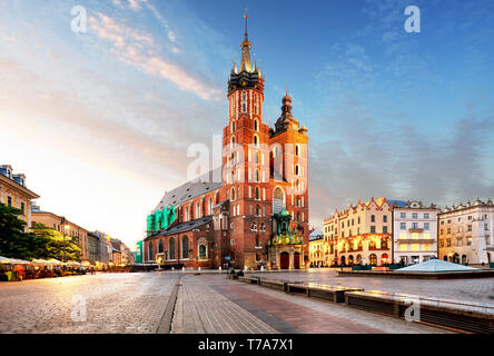 Old city center view with Adam Mickiewicz monument and St. Mary's Basilica in Krakow Stock Photo