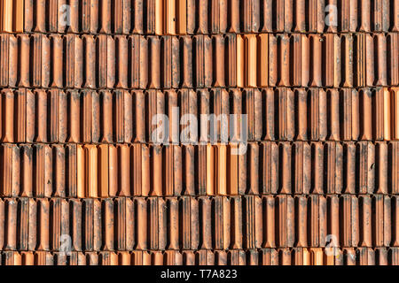 close up of traditional terracotta roof tiles on a building in Porto, Portugal. Stock Photo