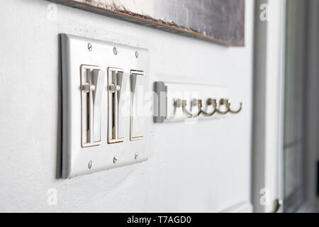 Miscellanous Items Household Power Push Button Toggle Switches Hanging Hooks Aligned Rows Stock Photo
