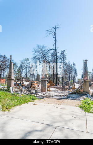 All that is left of a structure after the Camp Fire in Paradise, California are concrete columns. Stock Photo