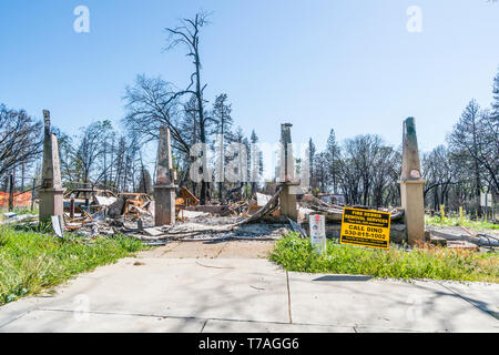 All that is left of a structure after the Camp Fire in Paradise, California are concrete columns. Stock Photo