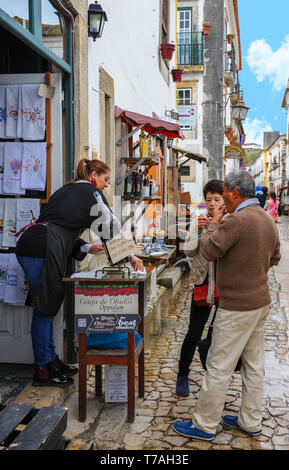 Traditional ginja at the streets of the Old Town of Obidos, Portugal Stock Photo