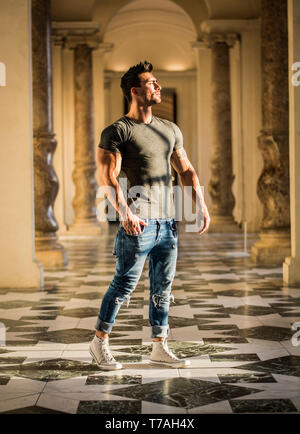 Handsome Man Looking Around Inside a Museum Stock Photo