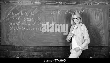 teacher on school lesson at blackboard. woman in classroom. Home schooling. happy woman. Back to school. Teachers day. Study and education. Modern school. Knowledge day. Enjoying time in college. Stock Photo