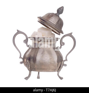 Vintage pewter sugar bowl with lid off to show white sugar cubes, isolated on white background. Highly decorated, ornate. Stock Photo