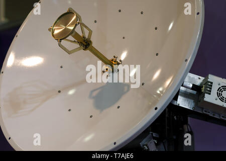 Close up view of the motorised satellite dish antenna. Selective focus. Stock Photo