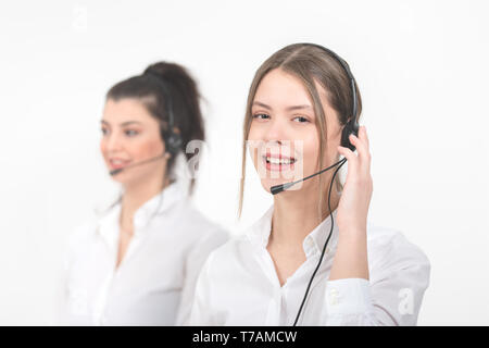Female consulting manager with headset on light background Stock Photo