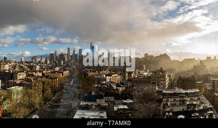 A panoramic sunset of Downtown Manhattan, New York City, which includes the World Trade Center (the Freedom Tower). Taken in Greenwich Village. Stock Photo