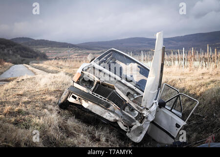 crashed car on the road Stock Photo