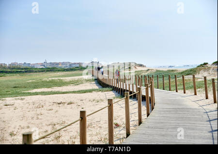 Wooden footwalk over the dunes in portugal near the beach Stock Photo