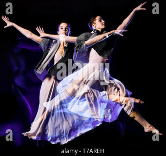 one caucasian woman modern ballet dancer dancing woman studio shot isolated on black bacground Stock Photo