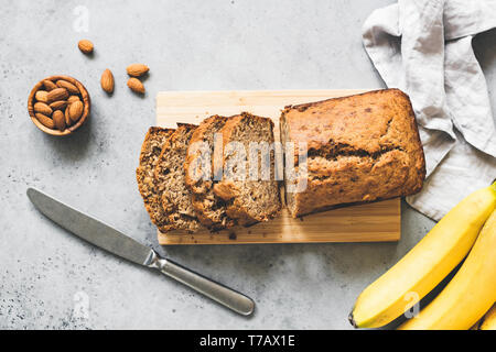 Gluten free paleo banana bread on grey concrete background, table top view Stock Photo